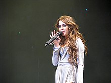 Miley Cyrus en concert lors du Wonder World Tour.