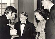 Brian Milton receives the first national trophy for hang gliding from the Queen in 1985 for his services to British hang gliding during the first ten years of this sport. Brian Milton Gets Hang-gliding Award from Queen in 1985.jpg