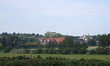 The Priory site from the south-east. The Gatehouse is at the north of the precinct: the church and convent buildings stood on the site of the farm Butley Abbey Farm from SE.jpg