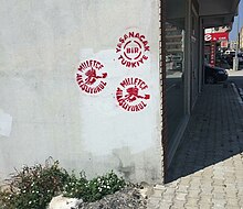 Street art depicting the CHP's two main campaign slogans, Milletce Alkisliyoruz (We applaud nationally) and Yasanacak bir Turkiye (A liveable Turkey) in Seferihisar, Izmir CHP 2015 general election street art.jpg