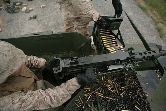 Charging handle being pulled on an M2 machine gun