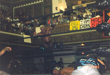 Candido performing the New Jersey Jam on Lance Storm.