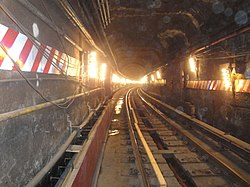 The IRT rebuilt the Steinway Tunnel, originally a trolley tunnel, for subway use. Concrete Benches on the No. 7 line (8510309583).jpg