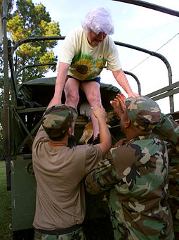 N.C. National Guard members help a woman near Tick Bite who was rescued by members from flood waters caused by Hurricane Floyd. Defense.gov News Photo 990918-F-0000J-002.jpg