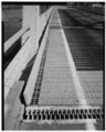 Detail of bridge deck and western expansion joint, looking east - Singing Bridge, U.S. Route 1, over Patchogue River, Westbrook, Middlesex County, CT HAER CONN,4-WESBK,2-13.tif
