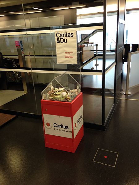 File:Donotion box for Caritas Austria, Archdiocese of Vienna, in Vienna Airport, 2016.jpg