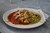 ''Enchiladas divorciadas'', half with mole coloradito and half with salsa verde, served at the 20 de Noviembre Market