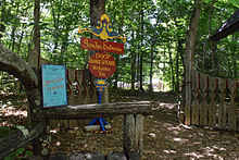 Playbill near the entrance of an outdoor theater in Baileys Harbor listing Romeo and Juliet and The Tempest as the shows for the 2015 acting season Entrance to Door Shakespeare outdoor theater - Bjorklunden Baileys Harbor Wisconsin.jpg