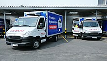 A Tesco delivery van in Poland advertising online ordering and delivery from a brick-and-mortar store. Tesco started their online presence in 1996. Ezakupy-tesco-2 (cropped).jpg