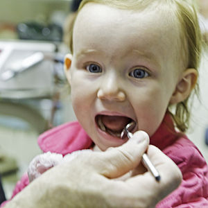 A little girl has her first visit to the dentist.