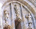 Bernlef (left) on the façade of a church holding his harp, sculpted by Willem Valk [nl; ca] in 1940[14]