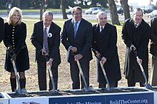 Jan Scruggs, second from left, at the groundbreaking for the Education Center at Vietnam Veterans Memorial on November 28, 2012 Groundbreaking for The Education Center at The Wall in Washington, DC.jpg