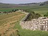 England invaderas av romarna denna dag 55 f.Kr. Hadrianusvallen i Northumberland är ett exempel på de många byggnadsverk romarna efterlämnade i England.