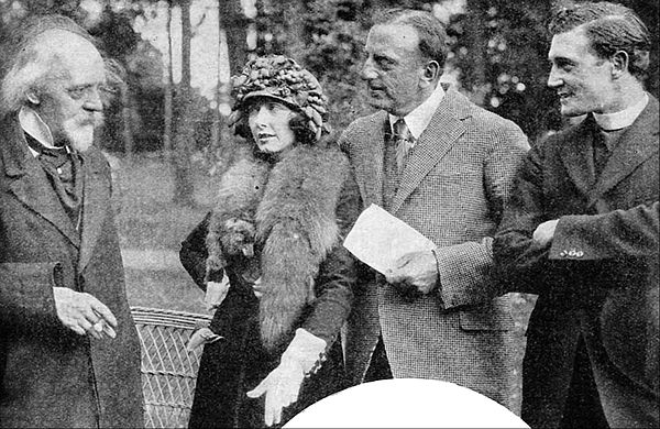 Hall Caine (left) visiting the film's set in 1922 and talking with Mae Busch, director Maurice Tourneur (holding paper), and Richard Dix