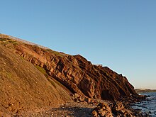 The 600 million year old (Precambrian) rock folds of Black Cliff, looking south. The 270-million-year-old Permian glacial pavement lies at the cliff top.