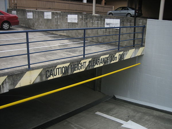 A sign at the entrance to an underground parking garage in March 2007, warning drivers of the maximum height clearance, in this case, roughly 2 meters