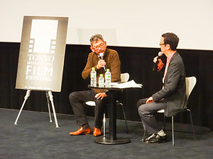 Hideaki Anno and Ryūsuke Hikawa (Meiji University) participating in "The World of Hideaki Anno" at the Tokyo International Film Festival on October 30, 2014.