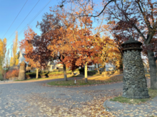 Stone towers topped with bird houses mark the entrance to the Rockwood Historic District on Highland Boulevard Highland Boulevard Towers.png