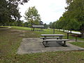 The rest area has some picnic tables, shelters and grilles...