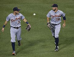 Ian Kinsler (3) and Tyler Collins (18) sporting numbers on the front of their road jerseys while playing for the Detroit Tigers in 2015 Ian Kinsler, Tyler Collins (20190066736).jpg