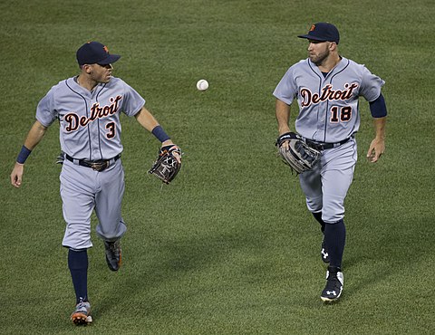 Ian Kinsler (3) and Tyler Collins (18) sporting numbers on the front of their road jerseys while playing for the Detroit Tigers in 2015