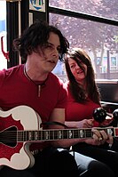 The White Stripes giving an impromptu show for fans on a bus in Winnipeg, Manitoba in 2007 Jack & Meg, On The Bus.jpg