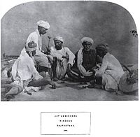 Ethnographic photograph of Jat zemindars (land owners) in Rajasthan, playing pachisi, 1874