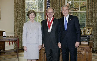 U.S. President George W. Bush and First Lady Laura Bush standing with 2005 National Humanities Medal recipient John Lewis Gaddis on November 10, 2005, in the Oval Office at the White House. Jl gaddis.jpg
