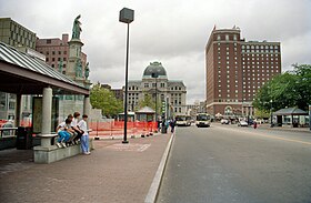 Kennedy Plaza in 1990, after it was redesigned to function as a central bus depot Kennedy Plaza 1990.jpg