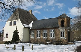 Former school in Klevesche houses with a bell tower