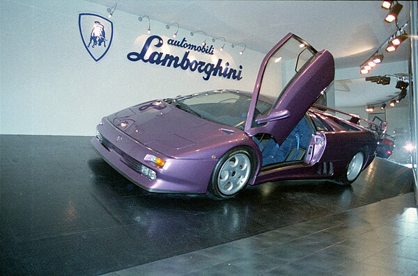 A purple Lamborghini Diablo SE30, similar to the one featured in the "Cosmic Girl" music video