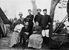 The members of the Lunda delimitation commission; also Mme. Sarmento and Mrs. Grenfell Lunda Delimitation Commission-1908.jpg
