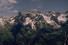 The Bockkarkopf (the peak in the right-hand side of the photo between the two large wind gaps) from the northwest. Other peaks from the left: Trettachspitze, Mädelegabel, Hochfrottspitze. Far right: the Wilder Mann