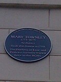 Дошка із зазначенням Мері Таунлі як архітектора будівлі