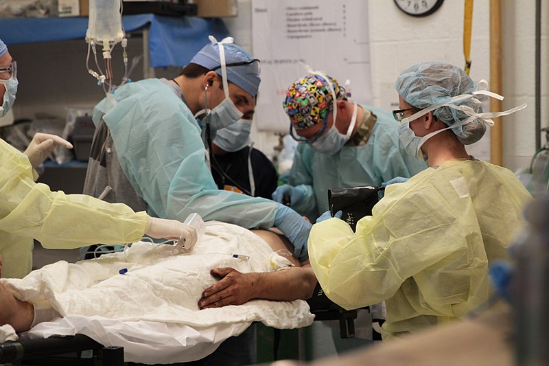 File:Members of the 541st Forward Surgical Team (FST) (Airborne) perform an assessment of an Afghan man on FOB Farah, December 26, 2012.jpg