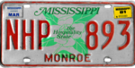 Mississippi plat, 1976-1981 seri dengan Maret 1981 sticker (Monroe County).png