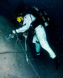 Onishi performing EVA on simulated asteroid during NEEMO 15 mission.[2]