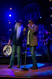 Fancy Free was the first number one for the Oak Ridge Boys (group members William Lee Golden and Richard Sterban pictured). Oak Ridge Boys at the Redneck Country Club, April 14, 2017 MG 2049 (34063731855).jpg