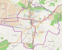 Mapa konturowa Ostrowa Wielkopolskiego, w centrum znajduje się punkt z opisem „Parafia Najświętszej Maryi Panny Królowej Polski”