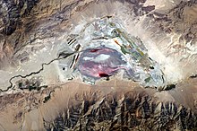 This astronaut photograph highlights the mostly dry bed of Owens Lake.