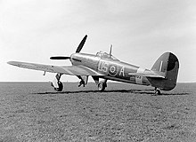 A Mark IB Typhoon US-A in April 1943. It was flown by Squadron Leader T.H.V Pheloung (New Zealand).[26][nb 5] An 18-inch-wide (460 mm) yellow recognition stripe is visible on the upper wing.