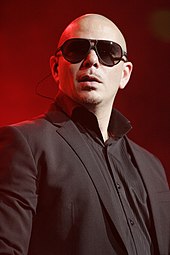 Cotoi was one of the writers of "Baddest Girl in Town", which appears on Pitbull's (pictured) studio album Dale. Pitbull, 2012 (2).jpg