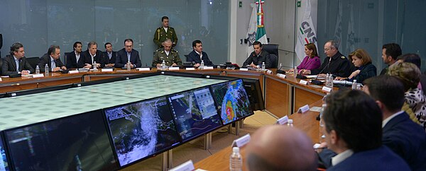 President Enrique Peña Nieto meets with cabinet members to discuss Hurricane Patricia on October 23