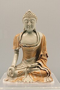 Qingbai(bluish white) glazed buddha statue, Jingdezhen ware，1271～1368 A.D., a collection of Shanghai Museum