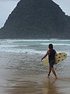 A surfer in Red Island beach