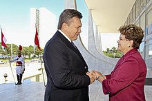 Brazilian President Dilma Rousseff greets Yanukovych upon his arrival to the Planalto Palace in Brasilia, Brazil, 25 October 2011. Rousseff and Yanukovych 2011.jpg
