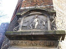 Gable stone of the old Sint Lucas guild above the door of its former location, Waag, Amsterdam. Sint-Lucasgilde.JPG