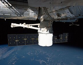 Dragon CRS-1 berthed to the International Space Station (ISS) on 14 October 2012, photographed from the Cupola. SpX CRS-1 berthed - cropped.jpg