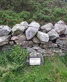Township boundary marker at Mungrisdale, Cumbria. The marker has been restored for historical purposes. Township marker mungrisdale.jpg