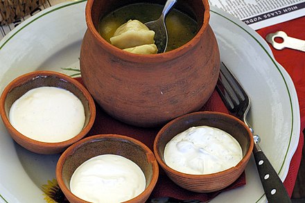 Pelmeni meat dumplings with three dipping sauces